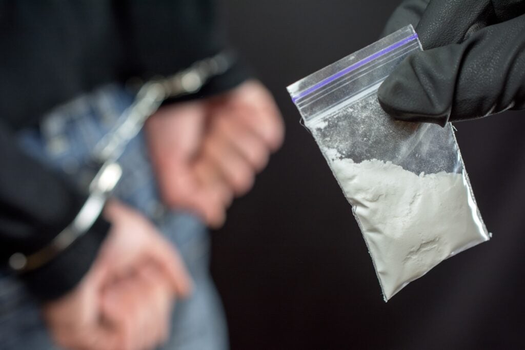 Police arrest drug trafficker with handcuffs
