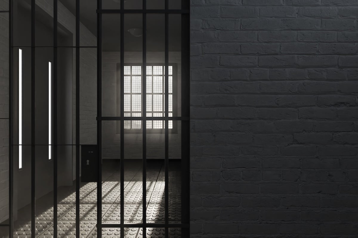 prison cell with brick wall