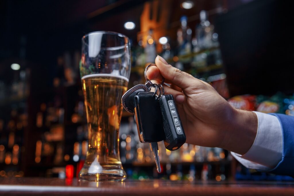 Do not drink and drive Cropped image of drunk man talking car keys