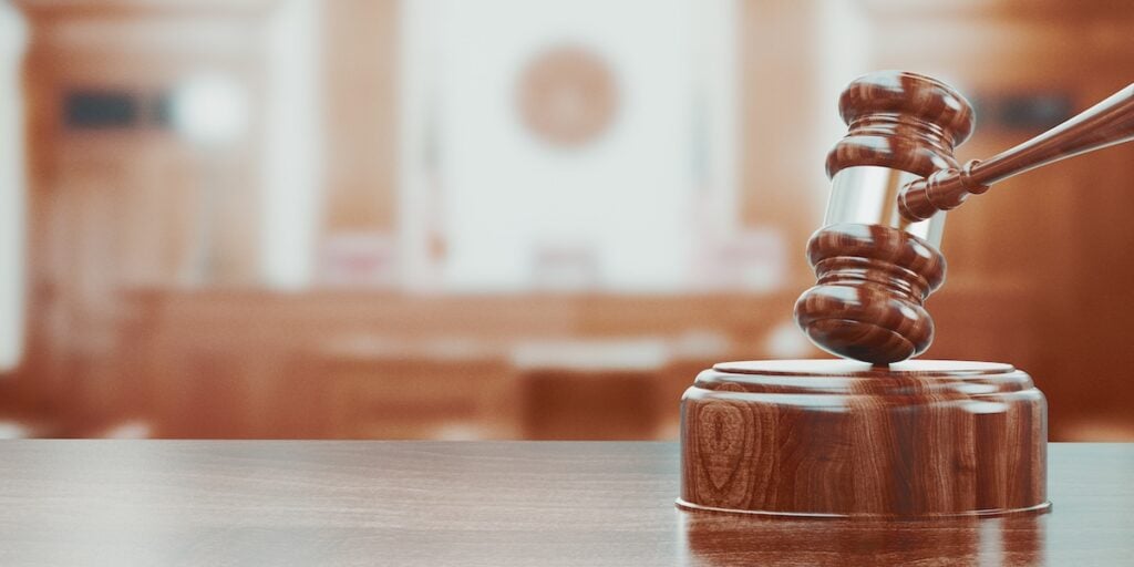 Wooden gavel on table close up. 