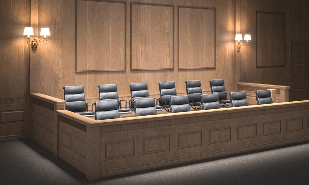 Empty jury box in courtroom awaiting jurors
