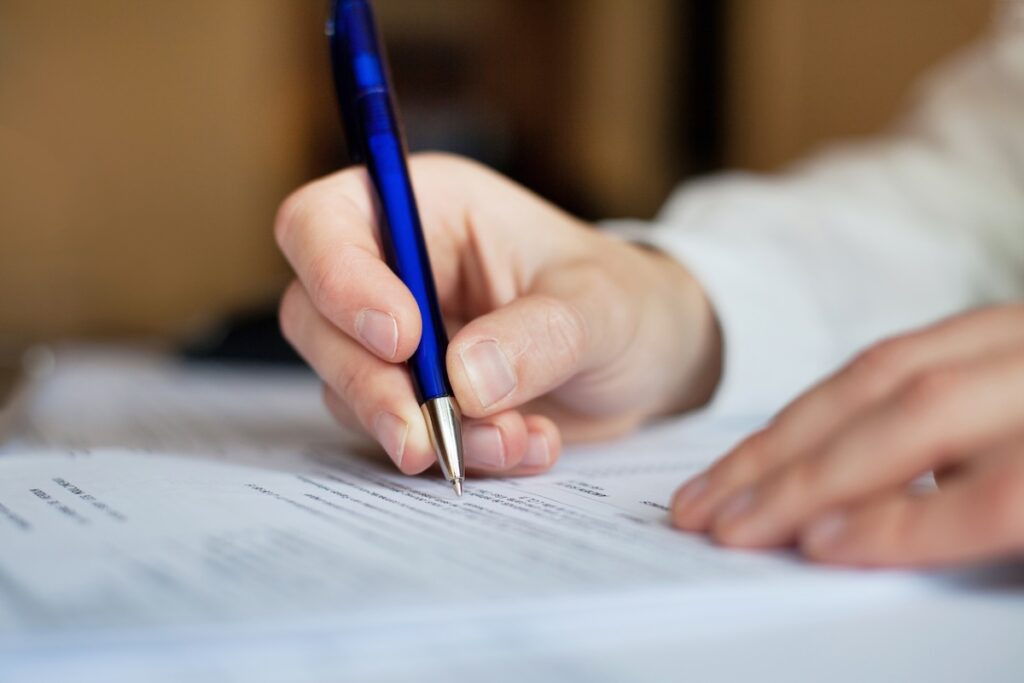 filling out paperwork for permit