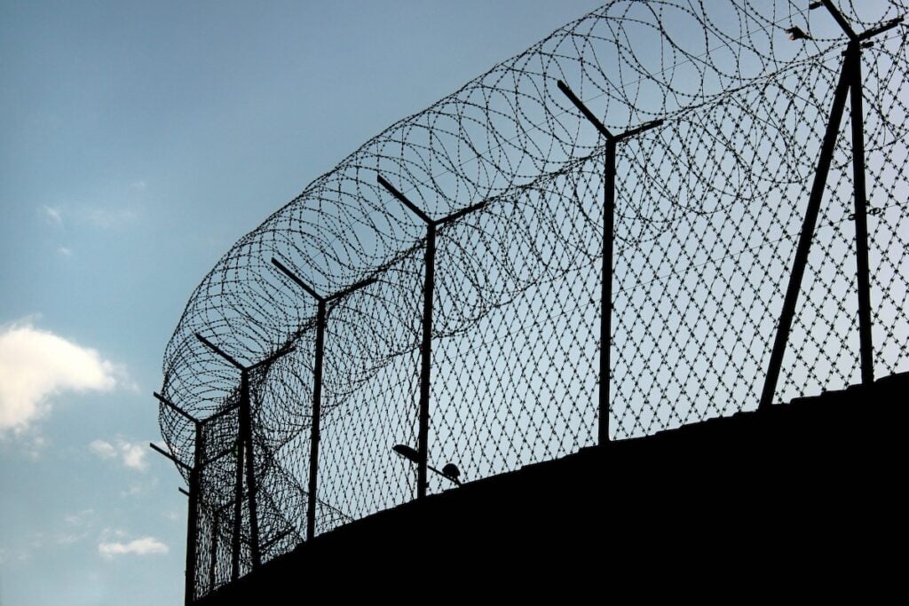 barbed wire on a prison fence